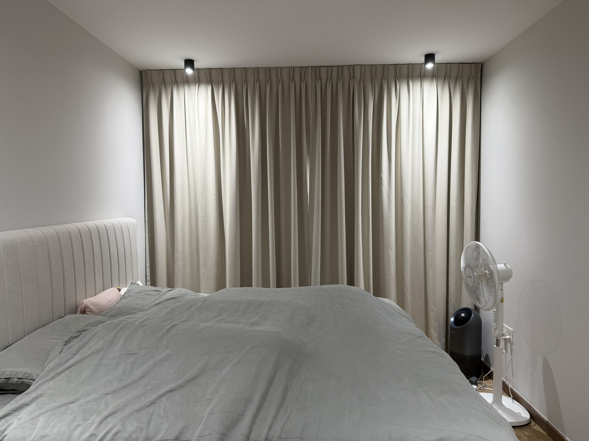 Residential living space featuring curtains and blinds